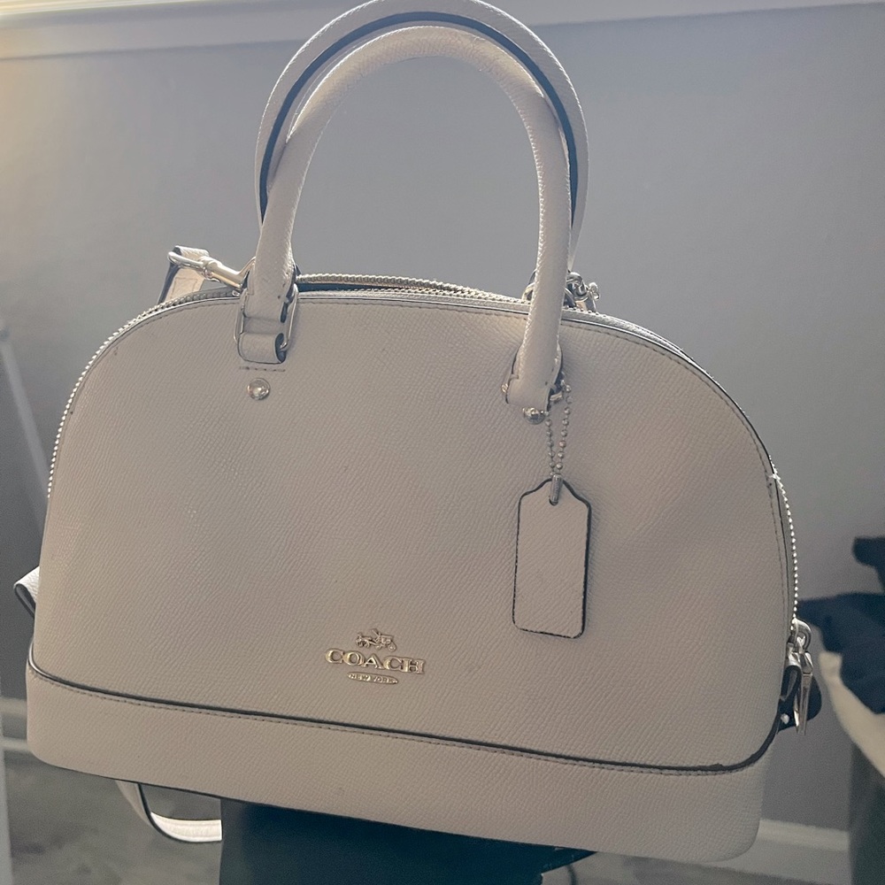 Cream colored coach purse